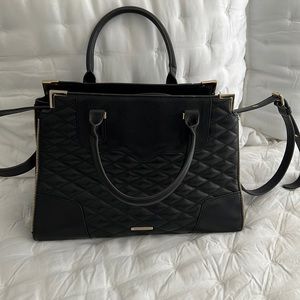 Black quilted Rebecca Minkoff handbag with gold zipper details